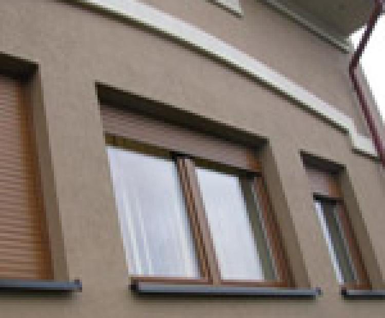 Top-mounted roller shutters
